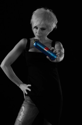 Black and White Female Portrait with colour bottle of hair spray - Photographed by Peter Gatt - PHOTO101.CA 